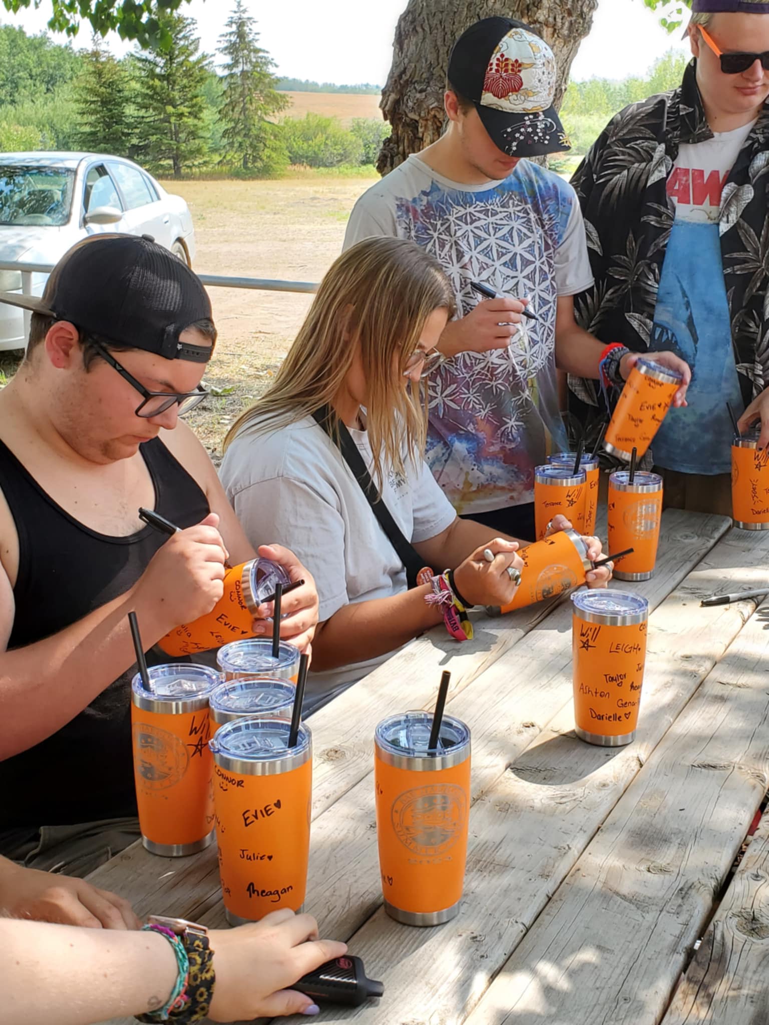 Camp Staff signing cups