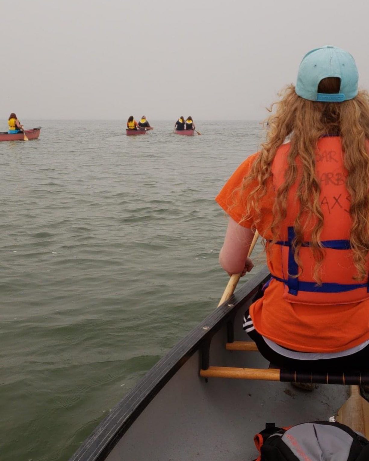 staff canoeing on a lake