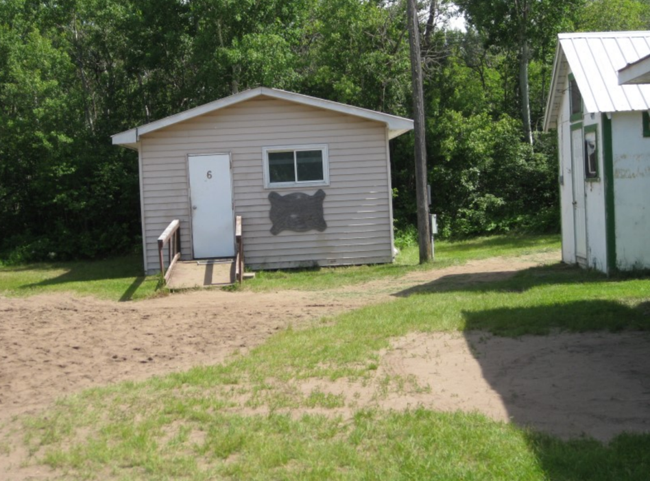 2 cabins in a field