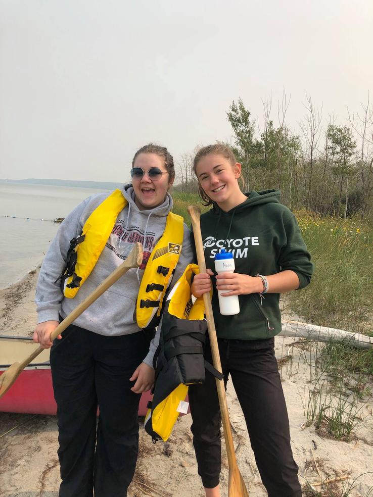 smiling campers ready to canoe