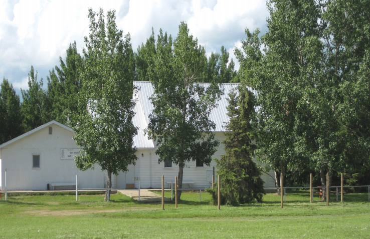 view across field to buildings